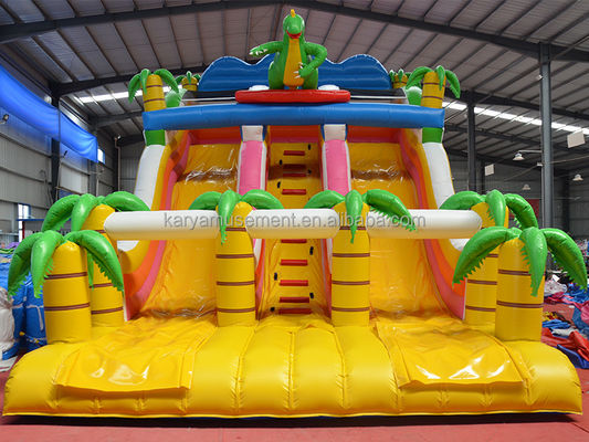 Parco all'aria aperta Gioco a 2 corsie Palma tropicale PVC gonfiabile Dinosauro Salto rimbalzo scivolo